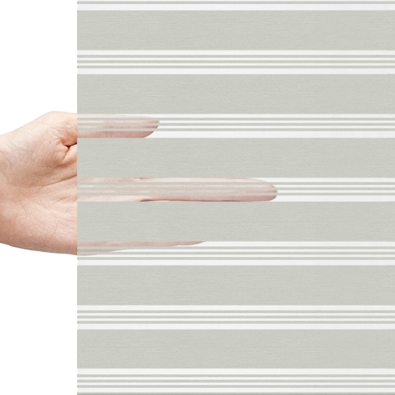 Berissa Artistic Oil Painting Zebra Shades Cordless Child Safe demonstrated with a hand showcasing light control features.