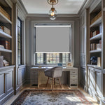 Berissa Classic Macaron Corded Pull Roller Shades in a modern office setting with a desk and bookshelves.