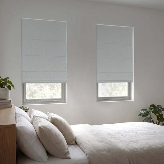 Berissa Ice Marble Texture Blackout No Tool Roman Shades adorning windows in a modern bedroom interior.