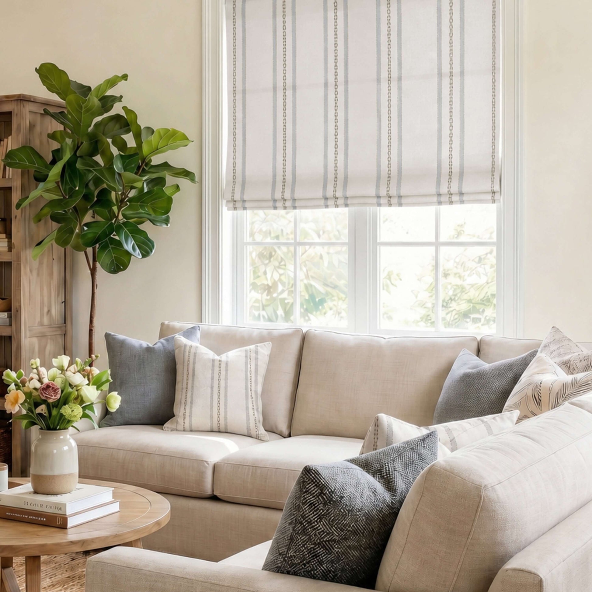 Cozy living room featuring Berissa No Tool Cotton Linen Cordless Relaxed Roman Shade and stylish throw pillows.