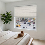 Berissa Obscura & Lumé Linen No Drill Custom Design Roman Shades in a modern bedroom with a view.