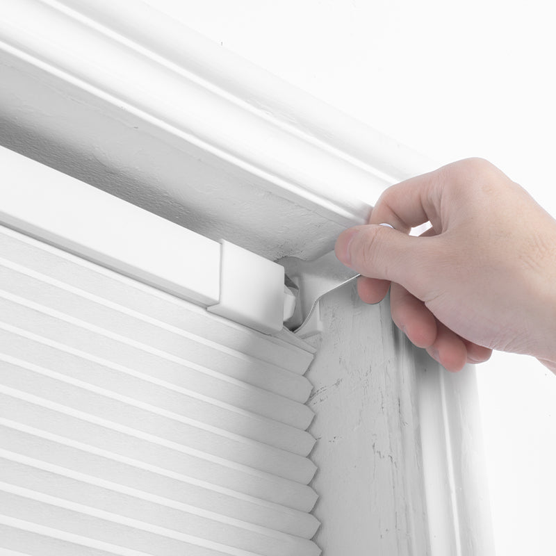 Installing the Berissa Classic No Drill Perfect Fit Cellular Shades in a window frame without tools.