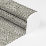 Berissa Full Wrap-around Cassette Valance Roller Shades showcasing a textured fabric pattern for elegant home decor.