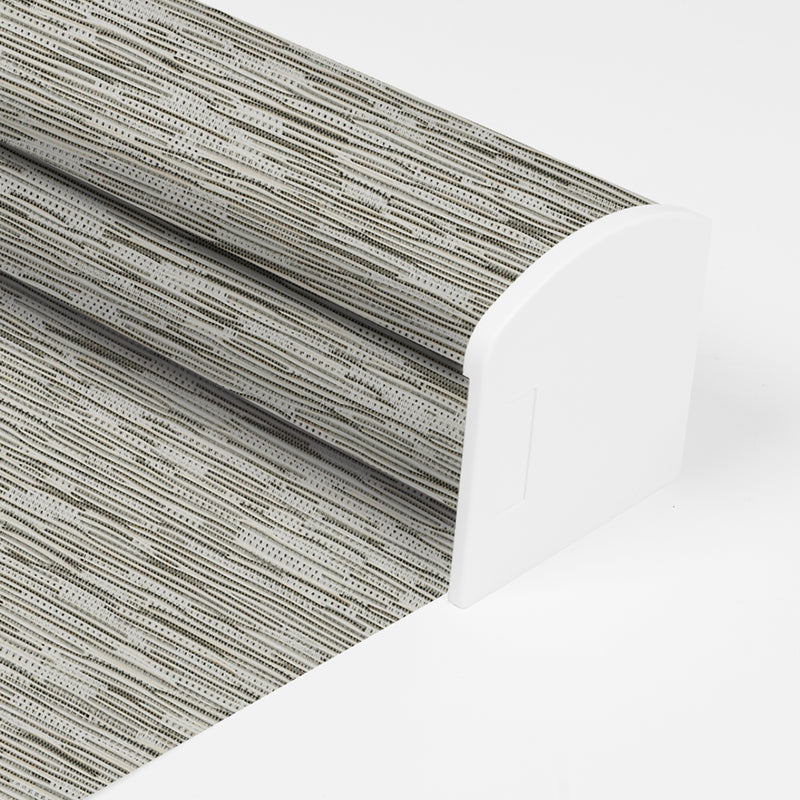Berissa Full Wrap-around Cassette Valance Roller Shades showcasing a textured fabric pattern for elegant home decor.
