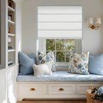 Berissa Custom Textured Blackout No Drill Quick installation Roman Shades in a cozy window nook with decorative pillows.