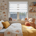 Berissa Day Night No Drill Zebra Duo Roller Blind in a cozy children's bedroom with soft decor.