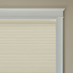Berissa Budget-Friendly Classic No Drill  Easy-Install Cellular Shades in a light beige color covering a window.