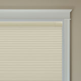 Berissa Budget-Friendly Classic No Drill  Easy-Install Cellular Shades in a light beige color covering a window.