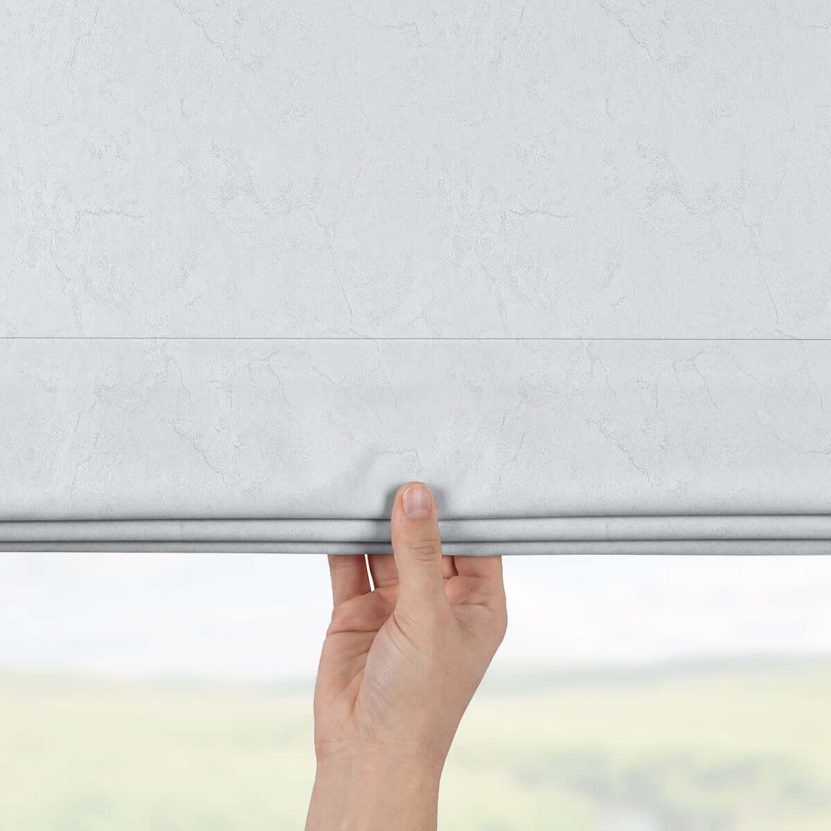 Person adjusting Berissa Ice Marble Texture Blackout No Tool Roman Shades, showcasing smooth ice marble design.