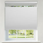 Berissa 1.5 Inch Heat Insulated Top Down Bottom Up Cellular Blinds in a window with a view of a garden.