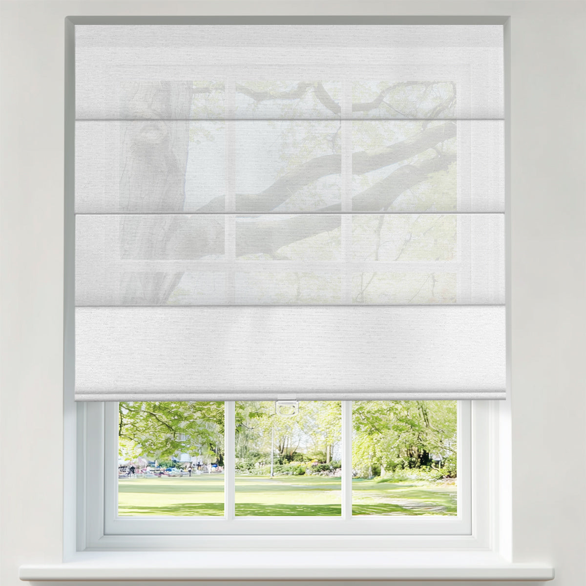 Berissa Custom Flat Fold Roman Shade Cordless installed in a window with a view of lush greenery.
