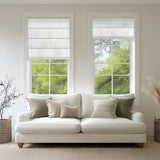 Living room featuring Berissa Custom Flat Fold Roman Shade Cordless over windows and a cozy white sofa.