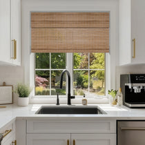 Berissa Cordless Warm Light Filtering Handcrafted Texture Bamboo Shades in a modern kitchen window.