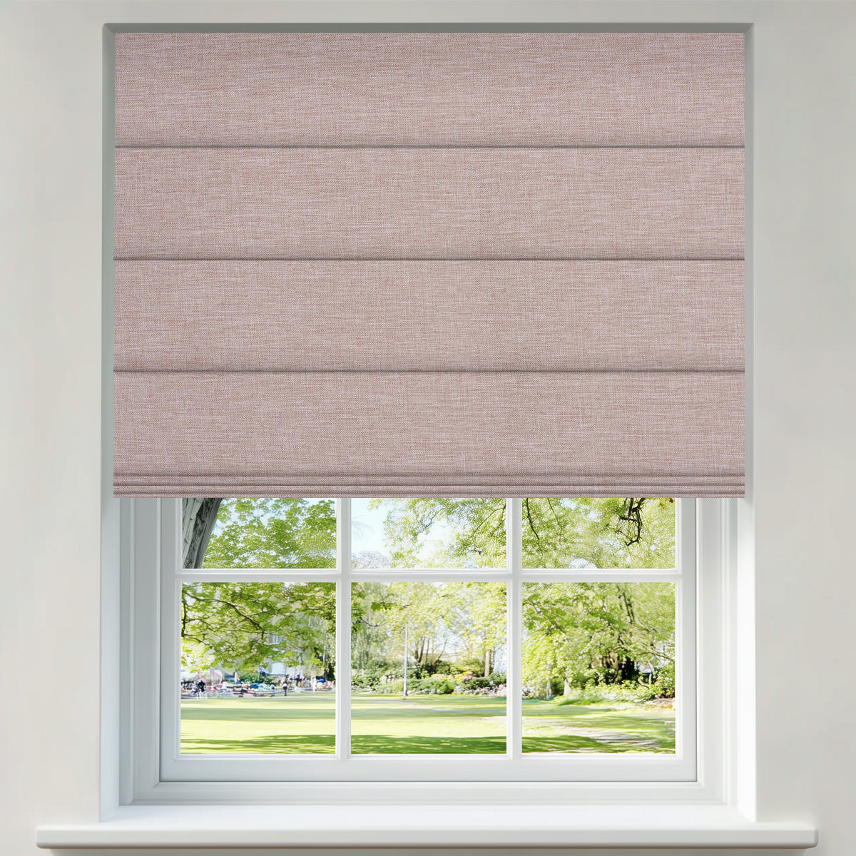 Berissa Simple Colors Uplifting Spaces Premium Linen Roman Shades adorning a window with a view of a lush garden.