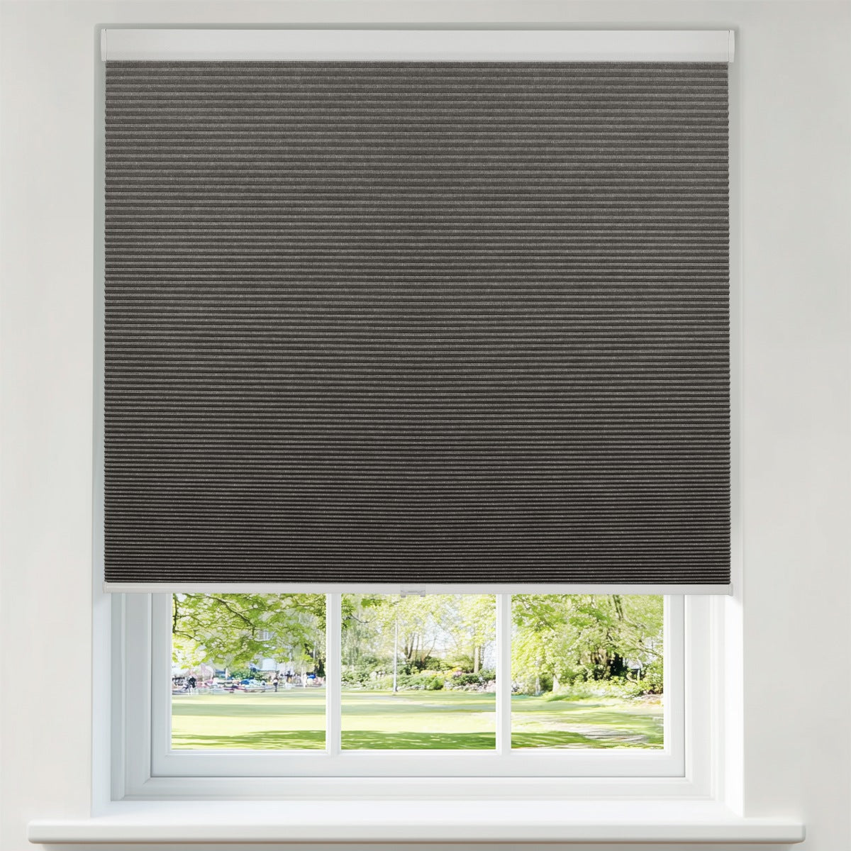 Berissa Blackout  Jacquard Textured Honeycomb Cellular Shades in a modern window setting with a view.