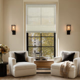 Cozy living room featuring Berissa Light Filtering Imitation Bamboo No Drill Roman Shades in a bright window.
