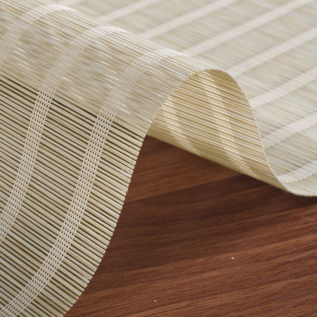Close-up view of Berissa Natural Style Faux Bamboo Roman Shades depicting woven faux bamboo texture.