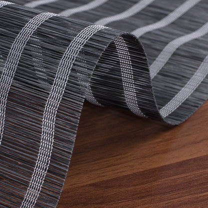 Berissa Natural Style Faux Bamboo Roman Shades detail with woven texture and gray stripes on wooden surface.