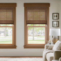 Berissa Cordless Light Filtering  Bamboo Roman Shades installed in modern living room window.
