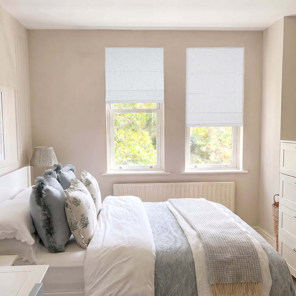 Berissa Ice Marble Texture Blackout No Tool Roman Shades in a bright, serene bedroom setting.