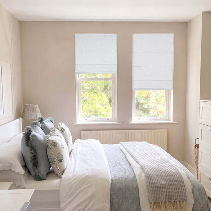 Berissa Ice Marble Texture Blackout No Tool Roman Shades in a bright, serene bedroom setting.