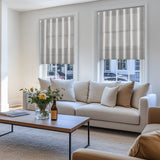 Berissa Candy Square Stripe Custom Roman Shades in a stylish living room with a cozy sofa and coffee table.